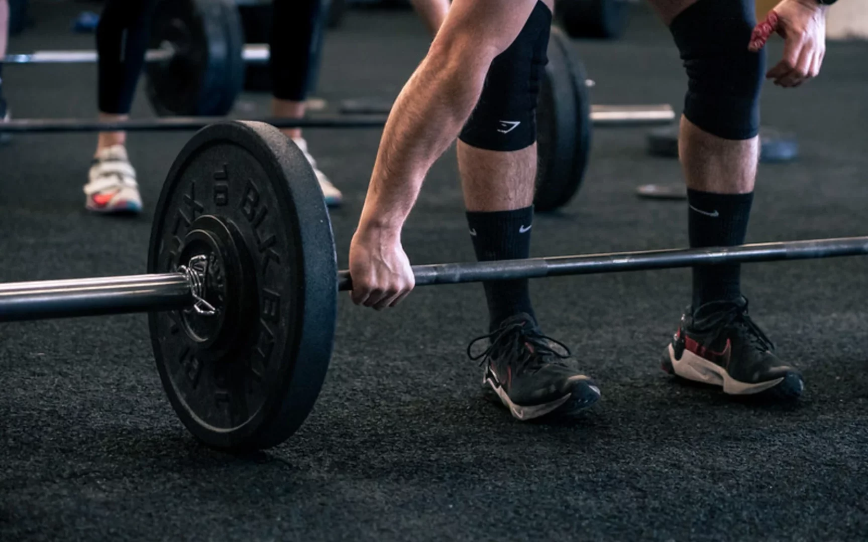 man with weight on floor